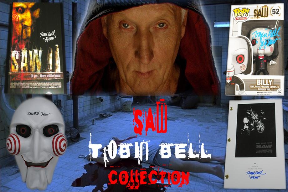 Showcase of the 'Saw' Tobin Bell Collection with a 'Saw' movie poster, a Billy the Puppet Funko Pop figure, an autographed white mask with red spirals, and a signed script cover, all set against a creepy bathroom scene reminiscent of the movie.