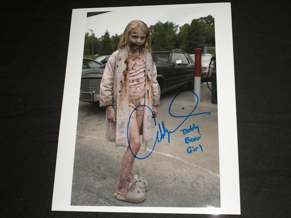 Signed 8x10 photo of Addy Miller as The Teddy Bear Girl from The Walking Dead, with JSA B authentication.